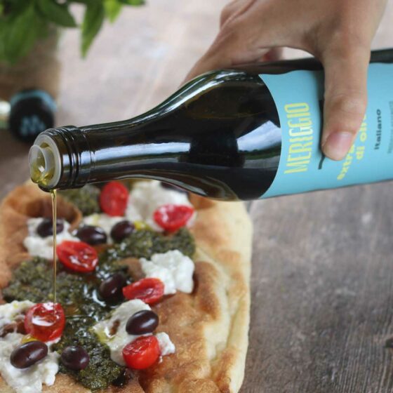 Drizzling Merrigio Italiano on Focaccia